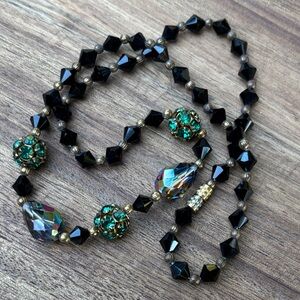 Elegant Black Glass Beaded Necklace with Green and Gold Accents